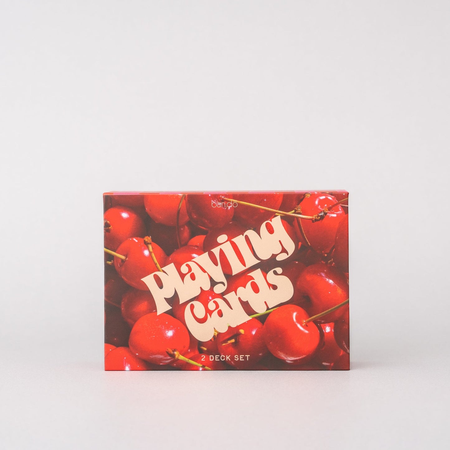 Playing cards box with cherry design on a white background