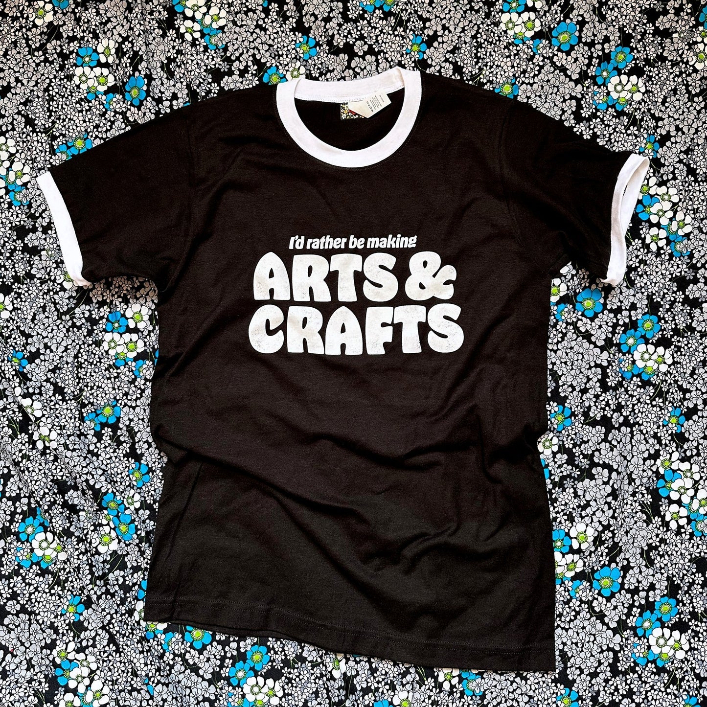 Black t-shirt with 'I'd rather be making ARTS & CRAFTS' text on a floral background